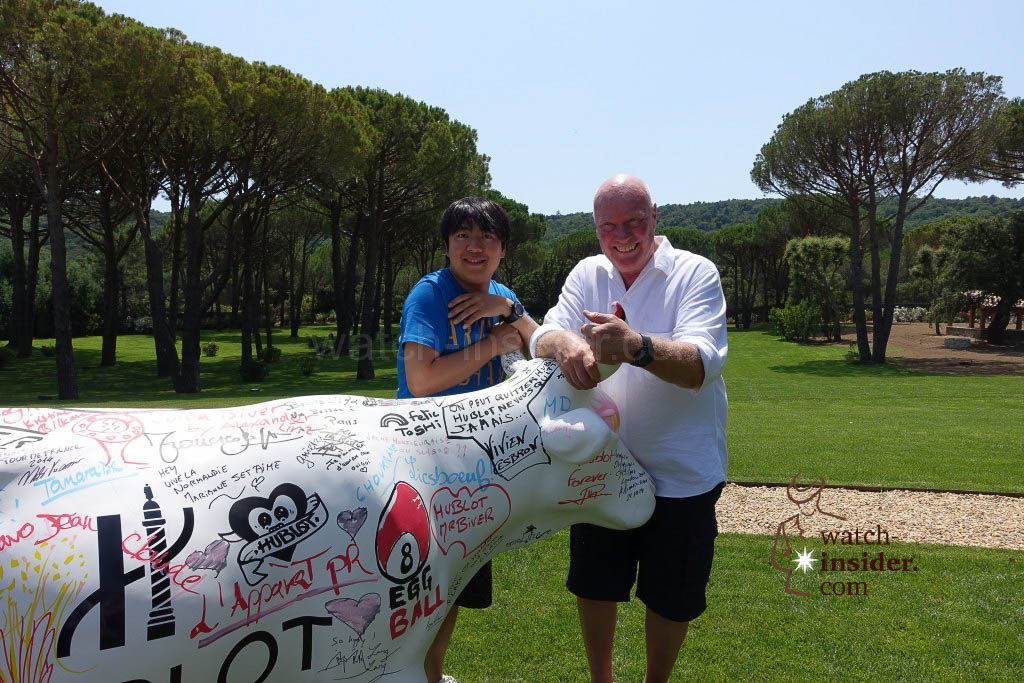 Lang Lang & Jean-Claude Biver standing in front the famous Hublot Cow that travels around the world and is signed by friends of Jean-Claude Biver.